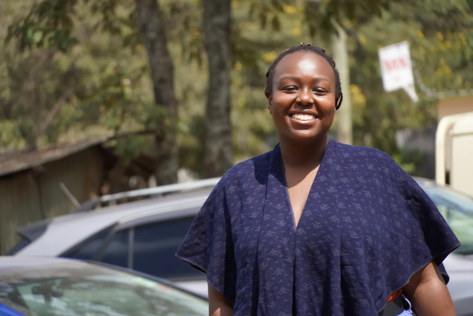 An OETWA community member smiling during a visit in Nairobi