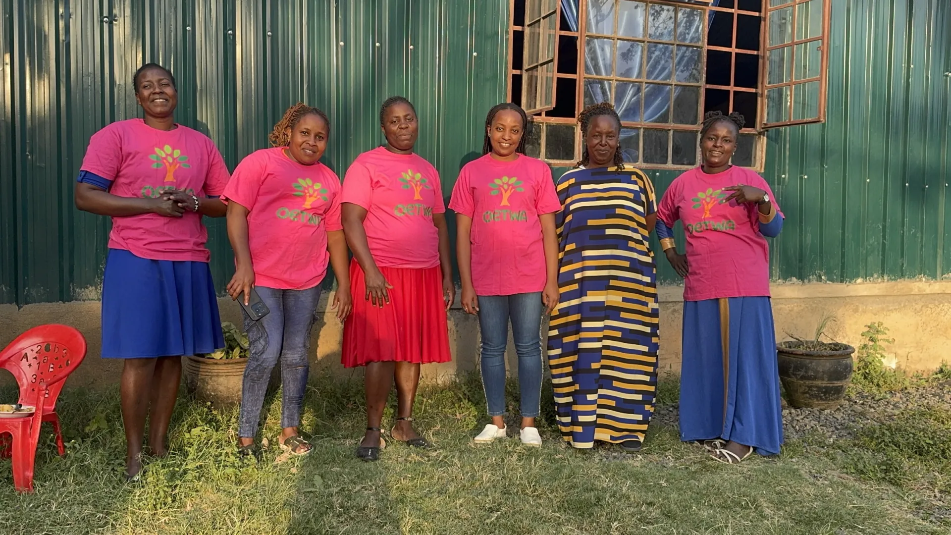 Six members of the OETWA team together outside their community centre